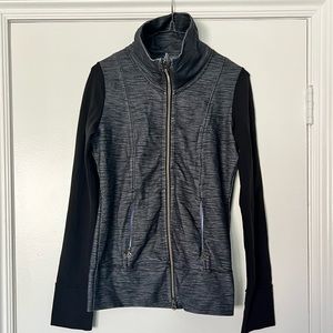 Lululemon size 6 zippered grey/blue body with black sleeves jacket.